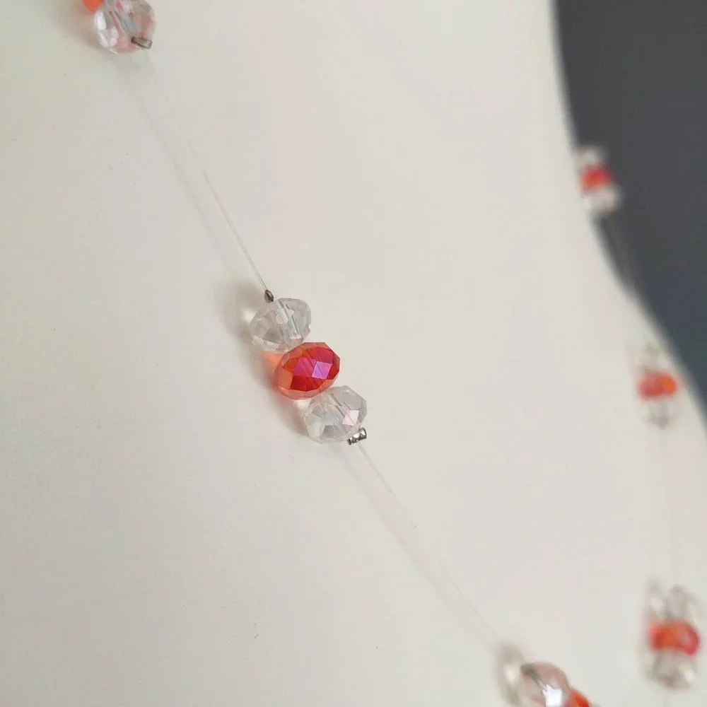 Floating clear and orange crystal necklace